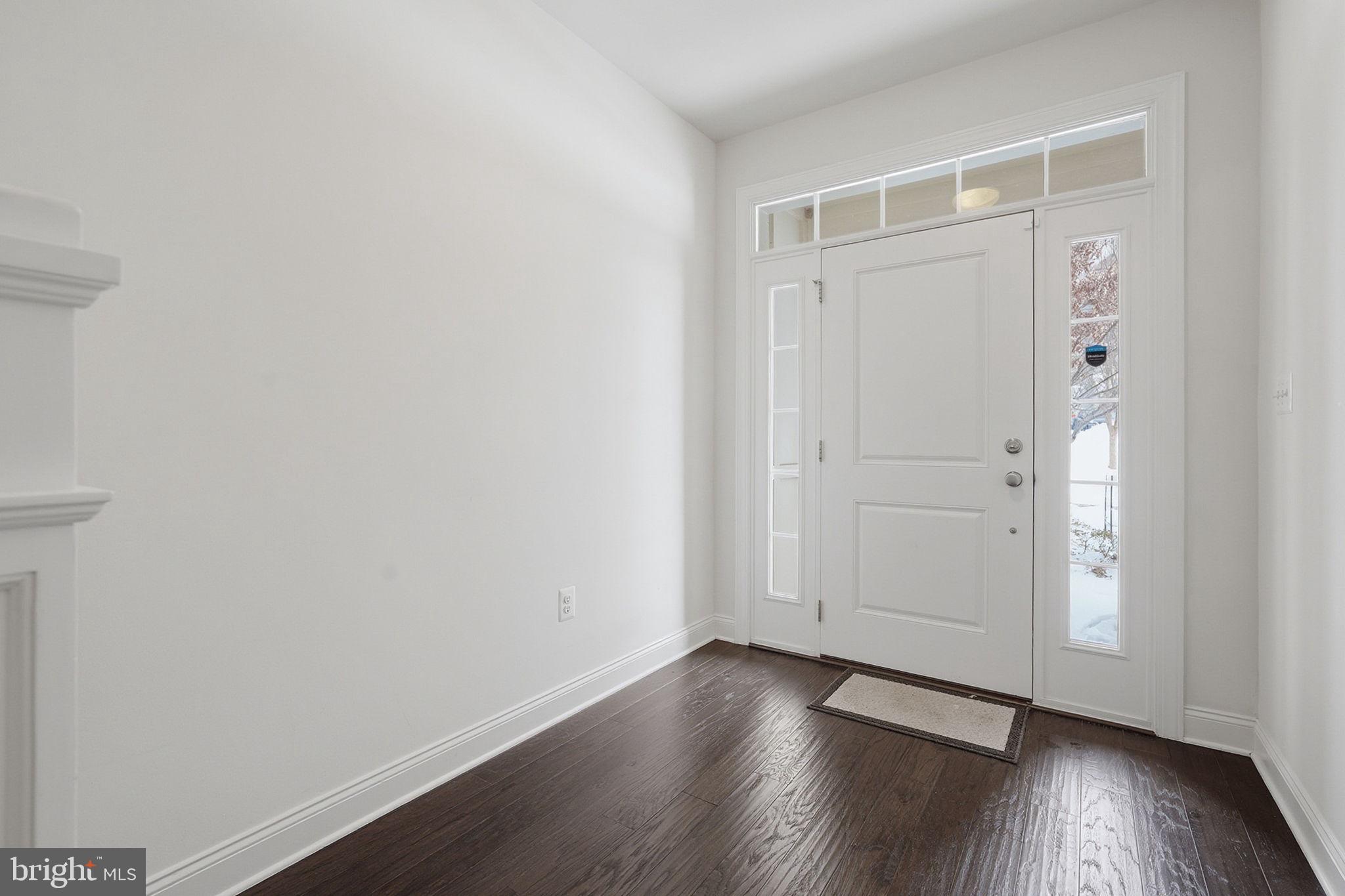 22597 Windsor Locks Square Ashburn, VA 20148 - Photo 2 of 44 a view of an empty room with wooden floor