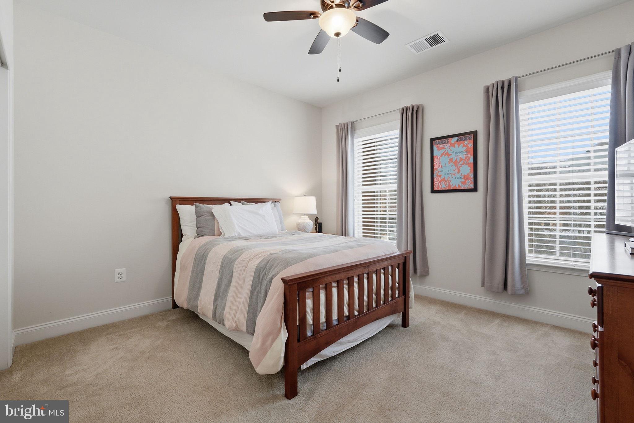22597 Windsor Locks Square Ashburn, VA 20148 - Photo 26 of 44 a spacious bedroom with a bed and window