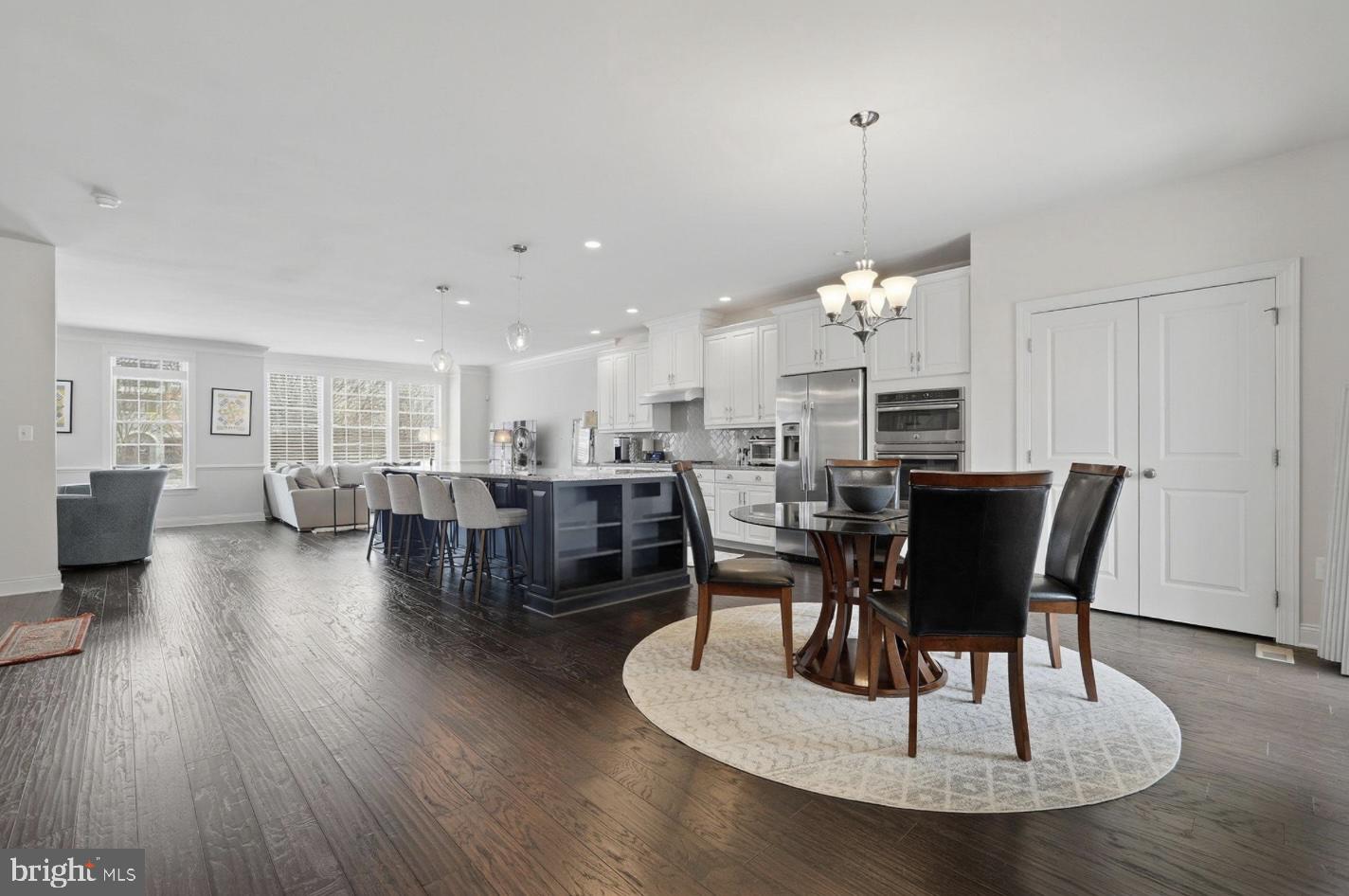 22597 Windsor Locks Square Ashburn, VA 20148 - Photo 3 of 44 a view of a dining room with furniture window and wooden floor