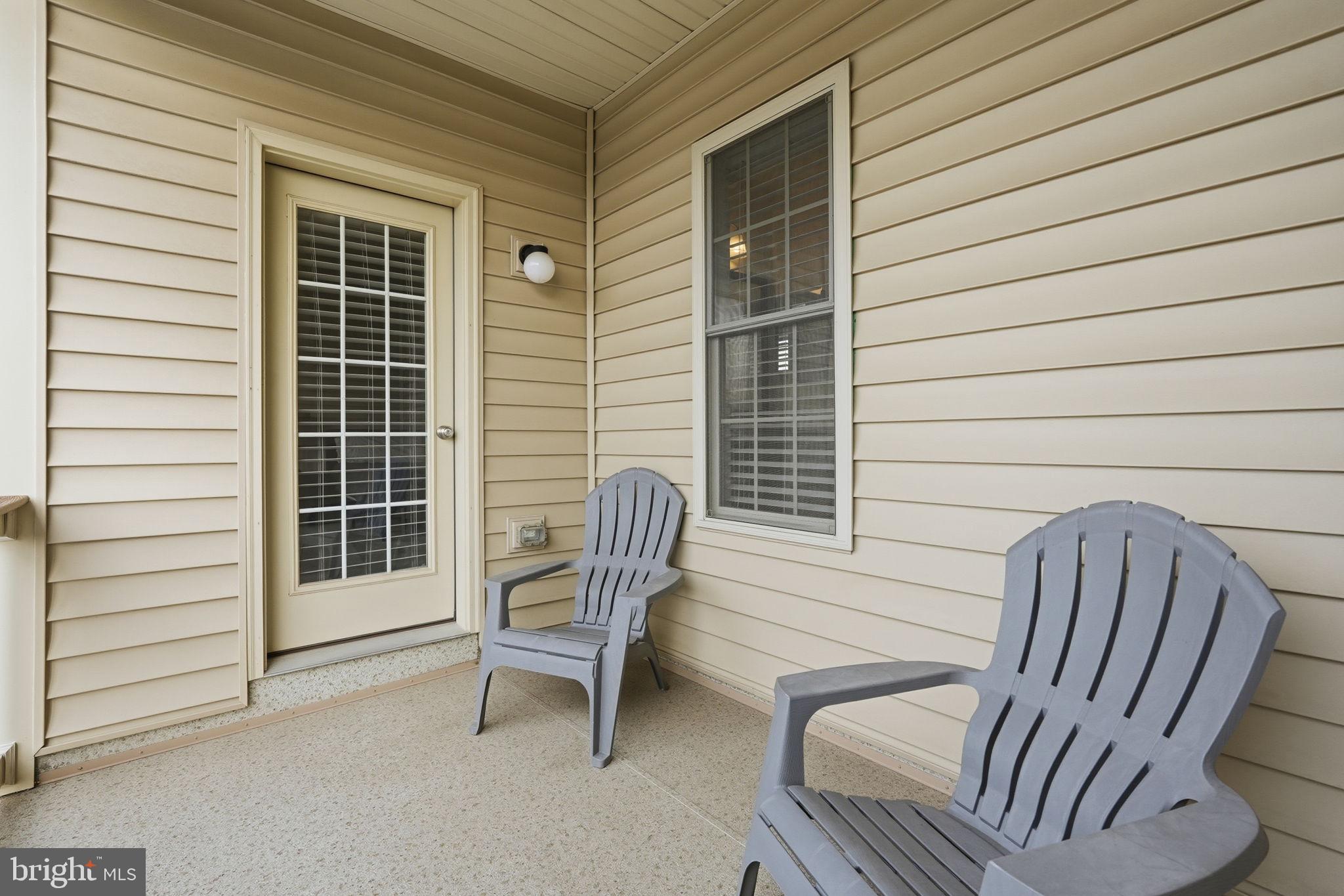 22597 Windsor Locks Square Ashburn, VA 20148 - Photo 36 of 44 a view of a chair and table in the back yard