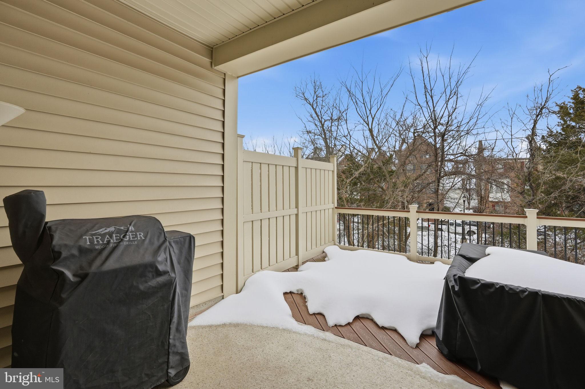 22597 Windsor Locks Square Ashburn, VA 20148 - Photo 37 of 44 a roof deck with couches and wooden fence