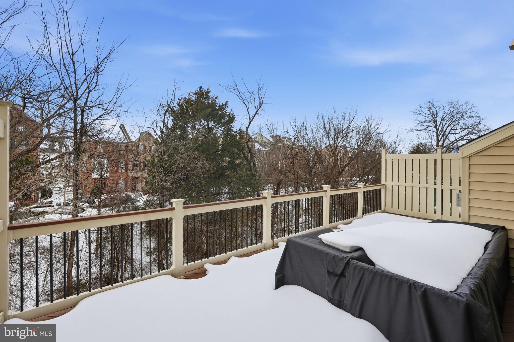 22597 Windsor Locks Square Ashburn, VA 20148 - Photo 38 of 44 a view of a roof deck with couches and wooden fence