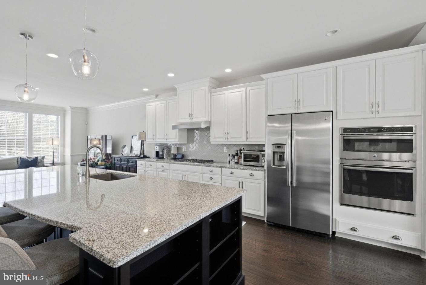 22597 Windsor Locks Square Ashburn, VA 20148 - Photo 9 of 44 a kitchen with a refrigerator a stove a sink and a microwave