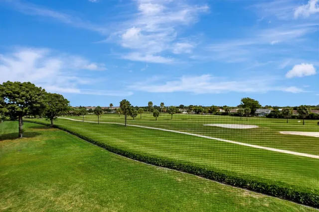 a view of a golf course with a lake