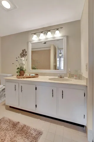 a bathroom with a sink double vanity and a mirror