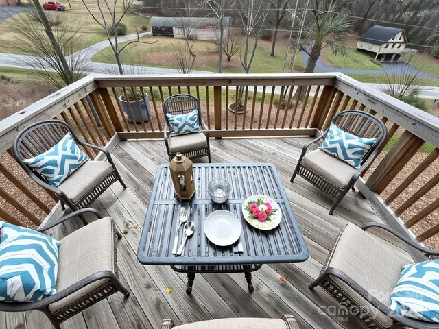 a view of a balcony with furniture and wooden floor