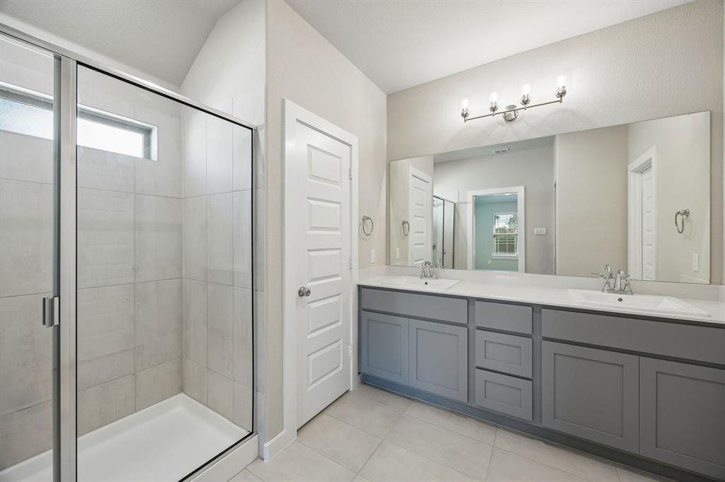 1424 Companero Street Haslet, TX 76052 - Photo 19 of 33 a bathroom with a double vanity sink mirror and double
