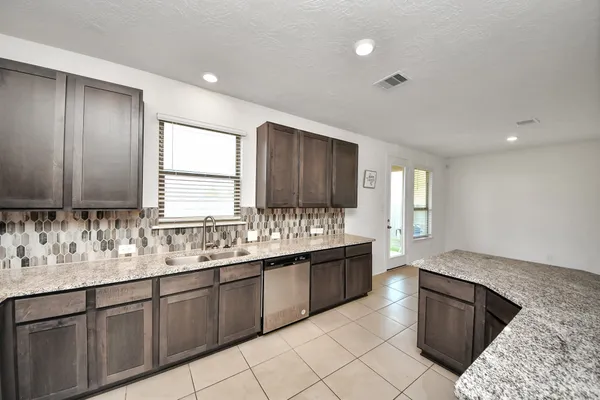 a bathroom with a sink vanity and mirror