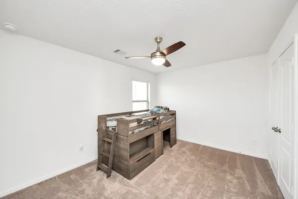 a view of a porch with furniture and a yard