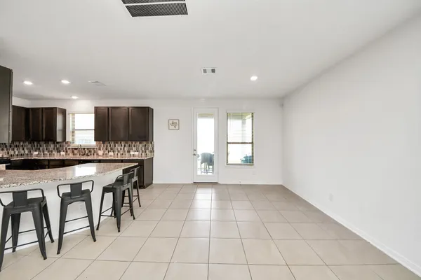 a view of a kitchen with microwave and cabinets