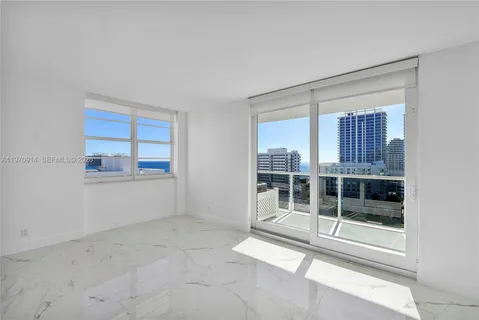 a view of an empty room with a window