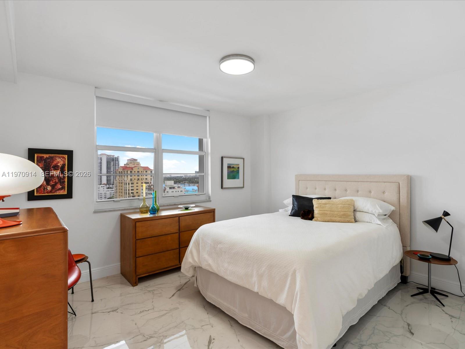 336 North Birch Road, Unit PH Fort Lauderdale, FL 33304 - Photo 17 of 68 a bedroom with a bed and a large window