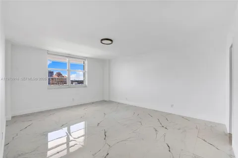 a bedroom with a bed and couch