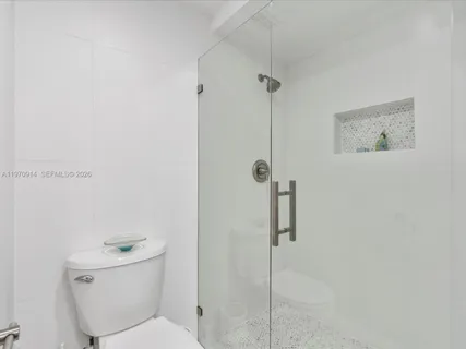 a bathroom with double vanity sink and a mirror