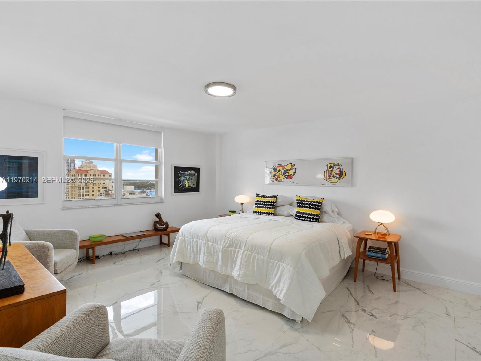 336 North Birch Road, Unit PH Fort Lauderdale, FL 33304 - Photo 22 of 68 a bedroom with a bed and couch