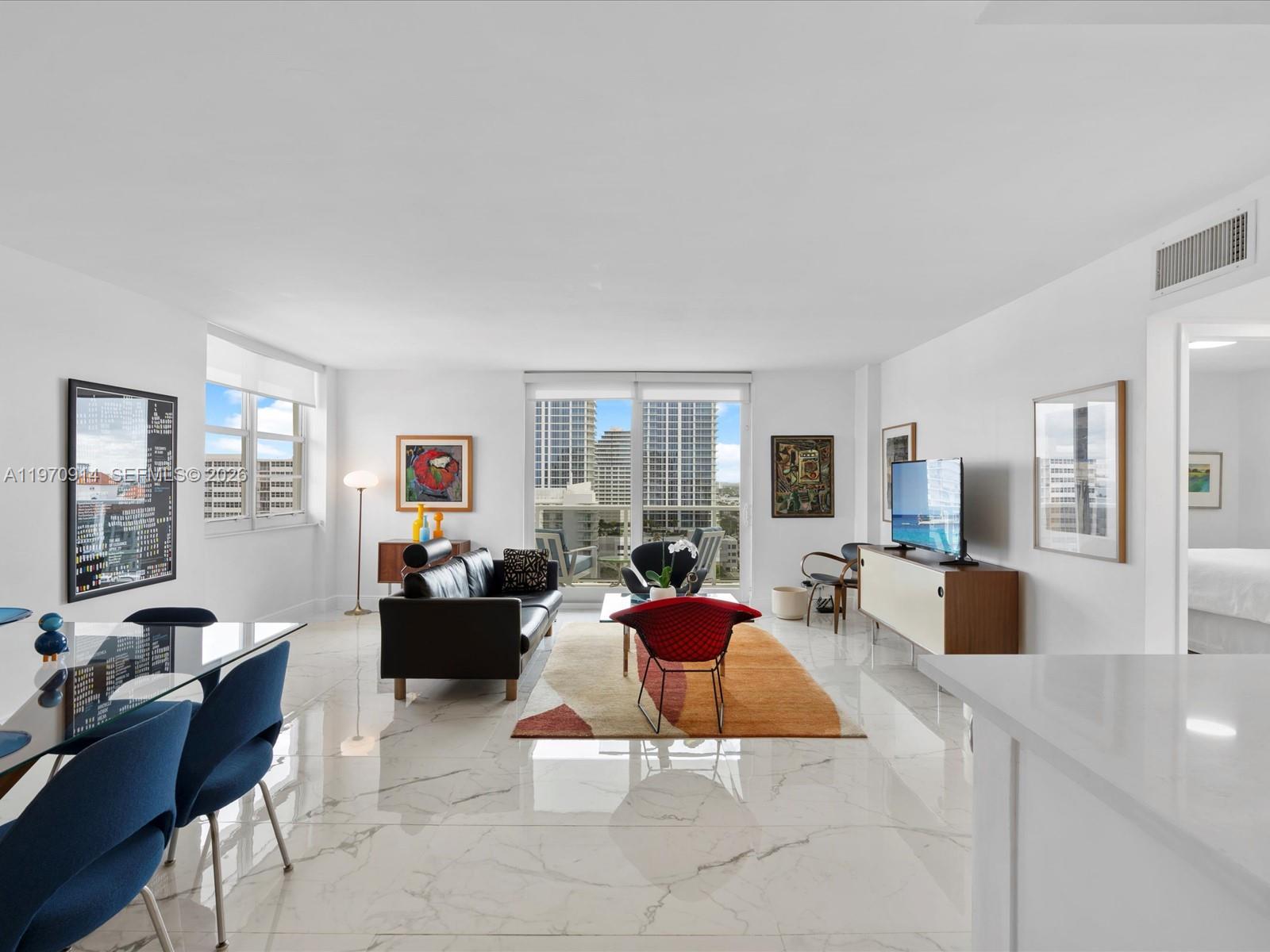 336 North Birch Road, Unit PH Fort Lauderdale, FL 33304 - Photo 3 of 68 a living room with furniture large window and couch
