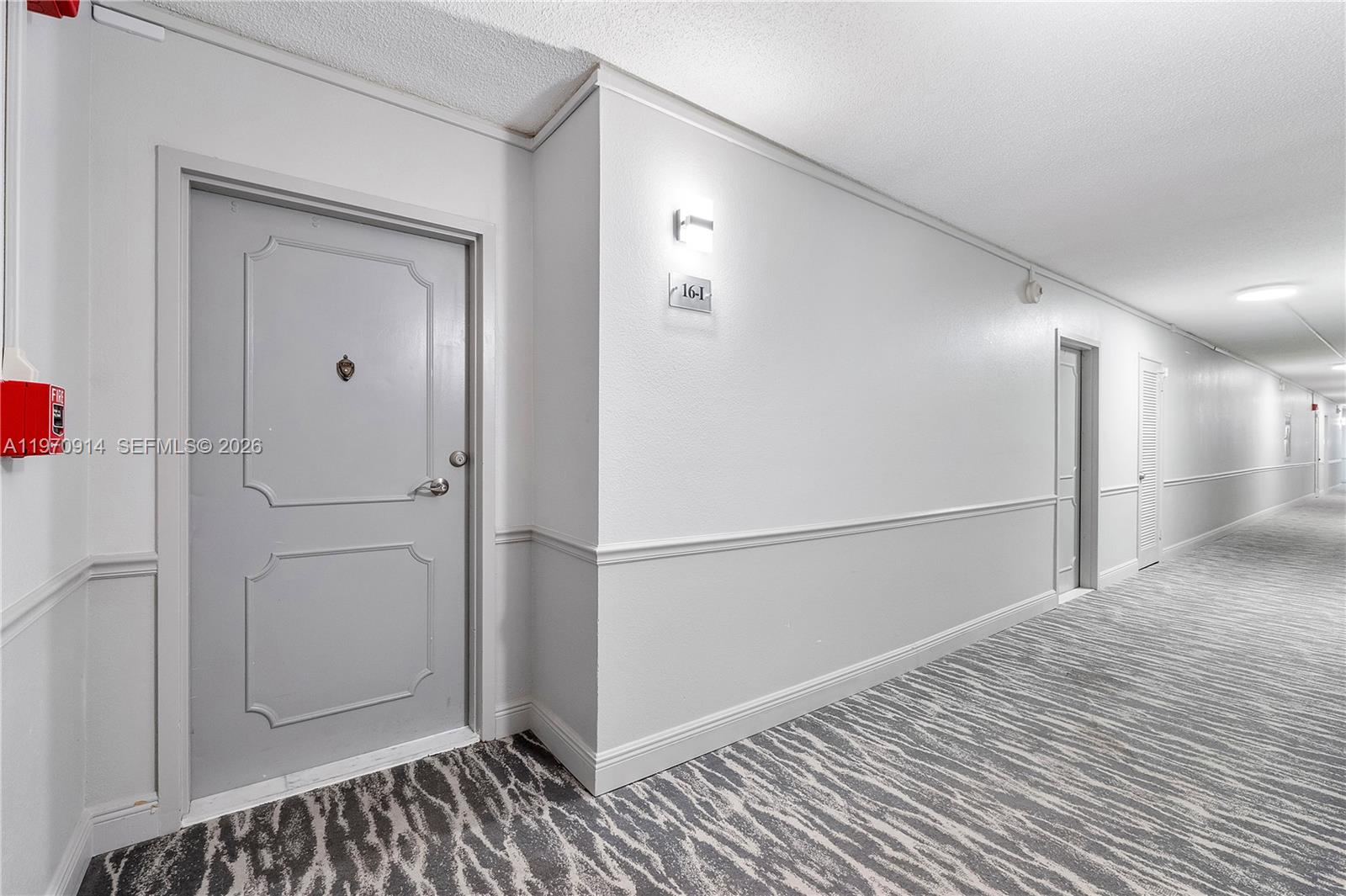 336 North Birch Road, Unit PH Fort Lauderdale, FL 33304 - Photo 32 of 68 a view of a hallway with wooden floor and closet area