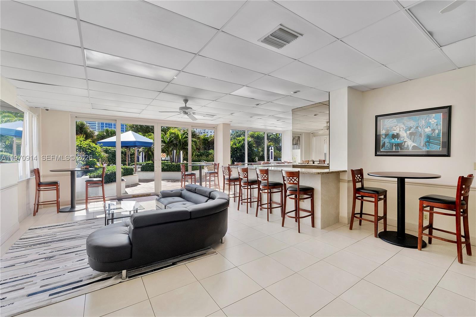 336 North Birch Road, Unit PH Fort Lauderdale, FL 33304 - Photo 36 of 68 a living room with furniture and a large window