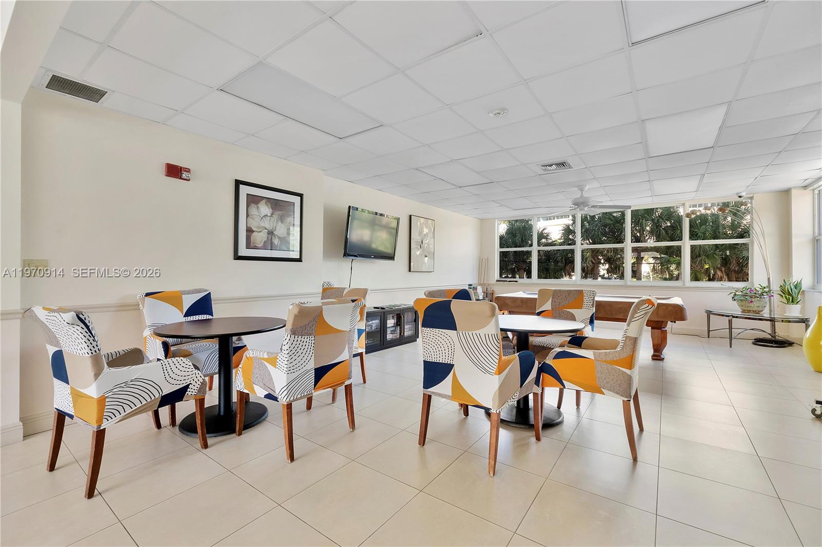 336 North Birch Road, Unit PH Fort Lauderdale, FL 33304 - Photo 37 of 68 a view of a dining room with furniture and window