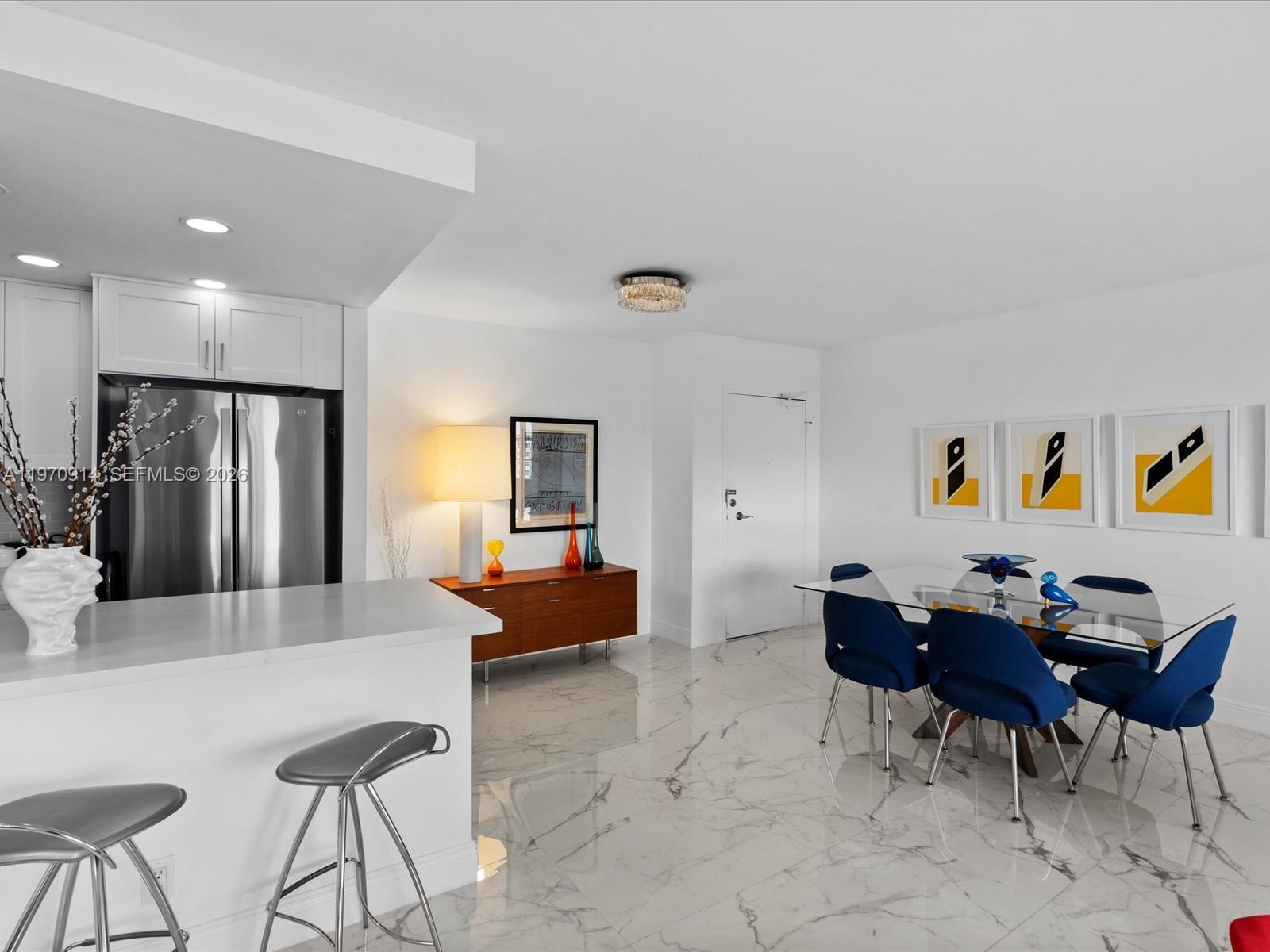 336 North Birch Road, Unit PH Fort Lauderdale, FL 33304 - Photo 9 of 68 a living room with furniture and a wooden floor