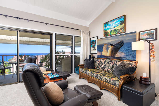 79-7199 Kona Coffee Villas, Unit 315 Holualoa, HI 96725 - Photo 2 of 28 a living room with furniture a couch and a floor to ceiling window