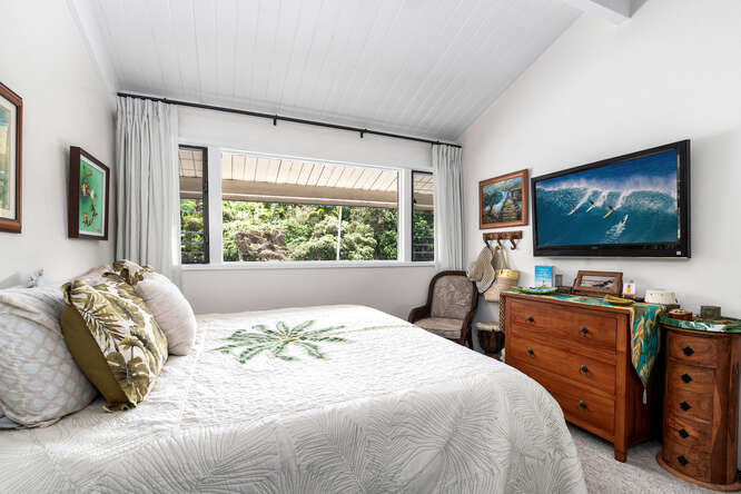79-7199 Kona Coffee Villas, Unit 315 Holualoa, HI 96725 - Photo 21 of 28 a bedroom with a bed and a flat screen tv