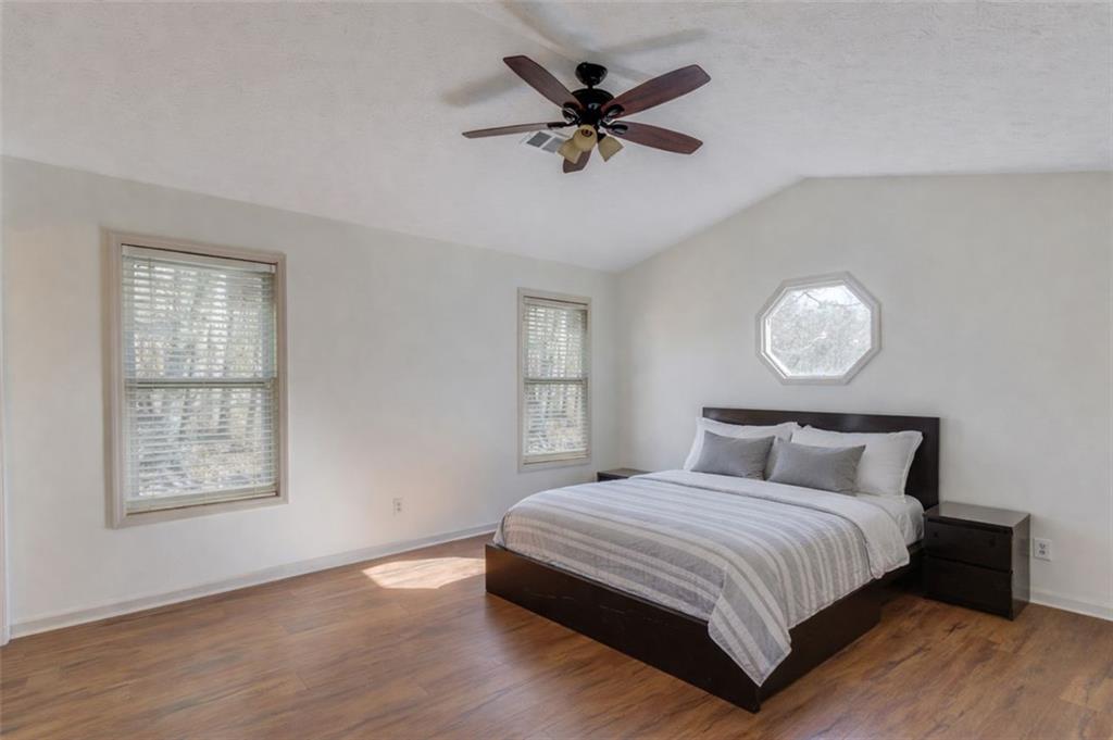 2965 Cordite Loop Snellville, GA 30039 - Photo 21 of 45 a bedroom with a large bed and a window