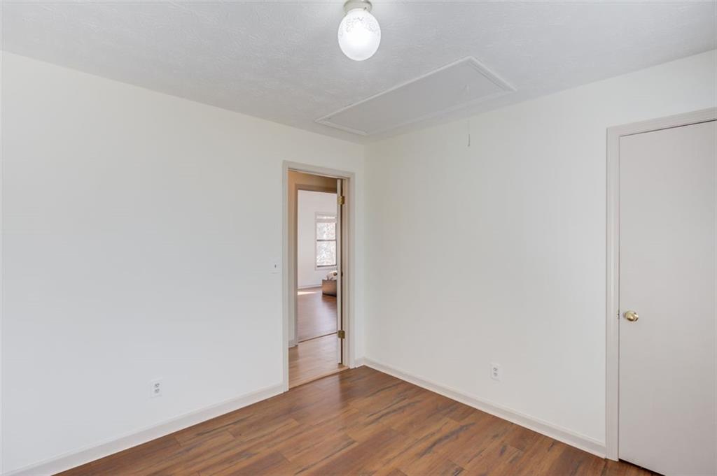 2965 Cordite Loop Snellville, GA 30039 - Photo 27 of 45 a view of an empty room with wooden floor and a window
