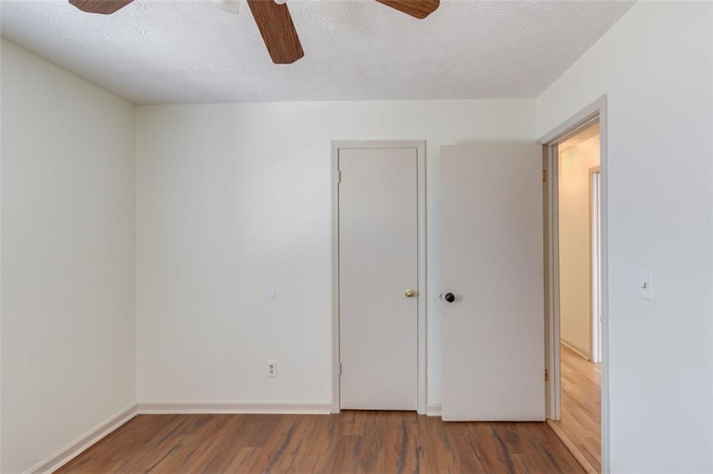 2965 Cordite Loop Snellville, GA 30039 - Photo 30 of 45 a view of an empty room and wooden floor