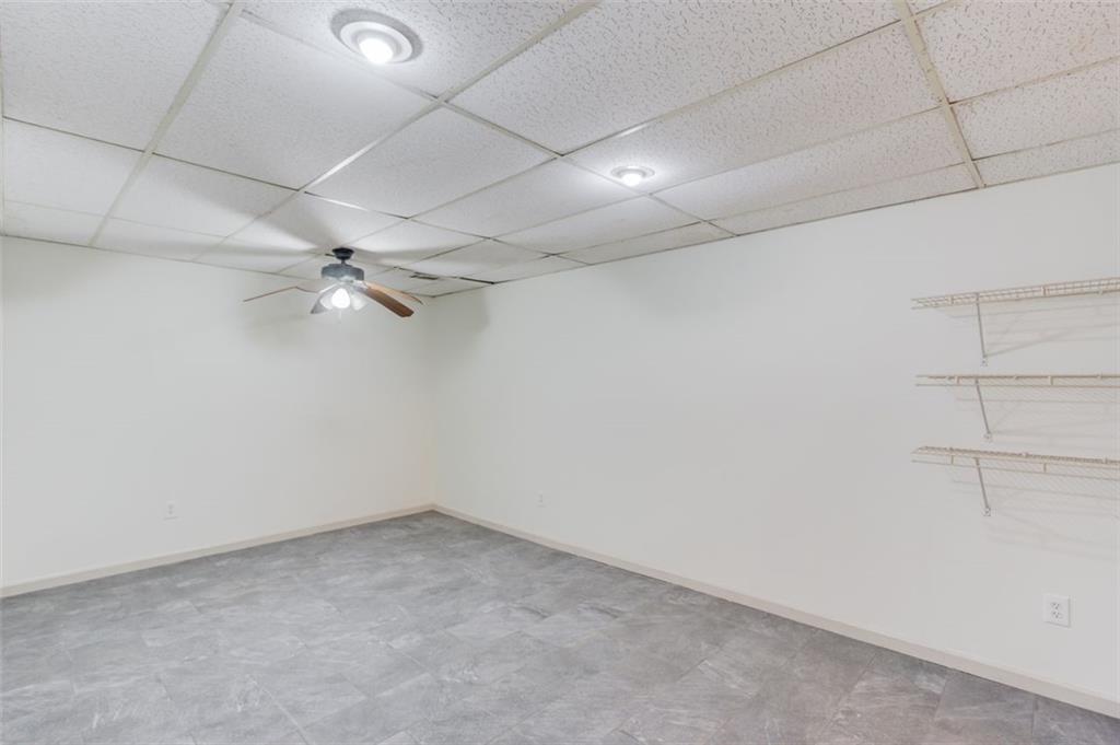 2965 Cordite Loop Snellville, GA 30039 - Photo 34 of 45 an empty room with a ceiling fan and carpet