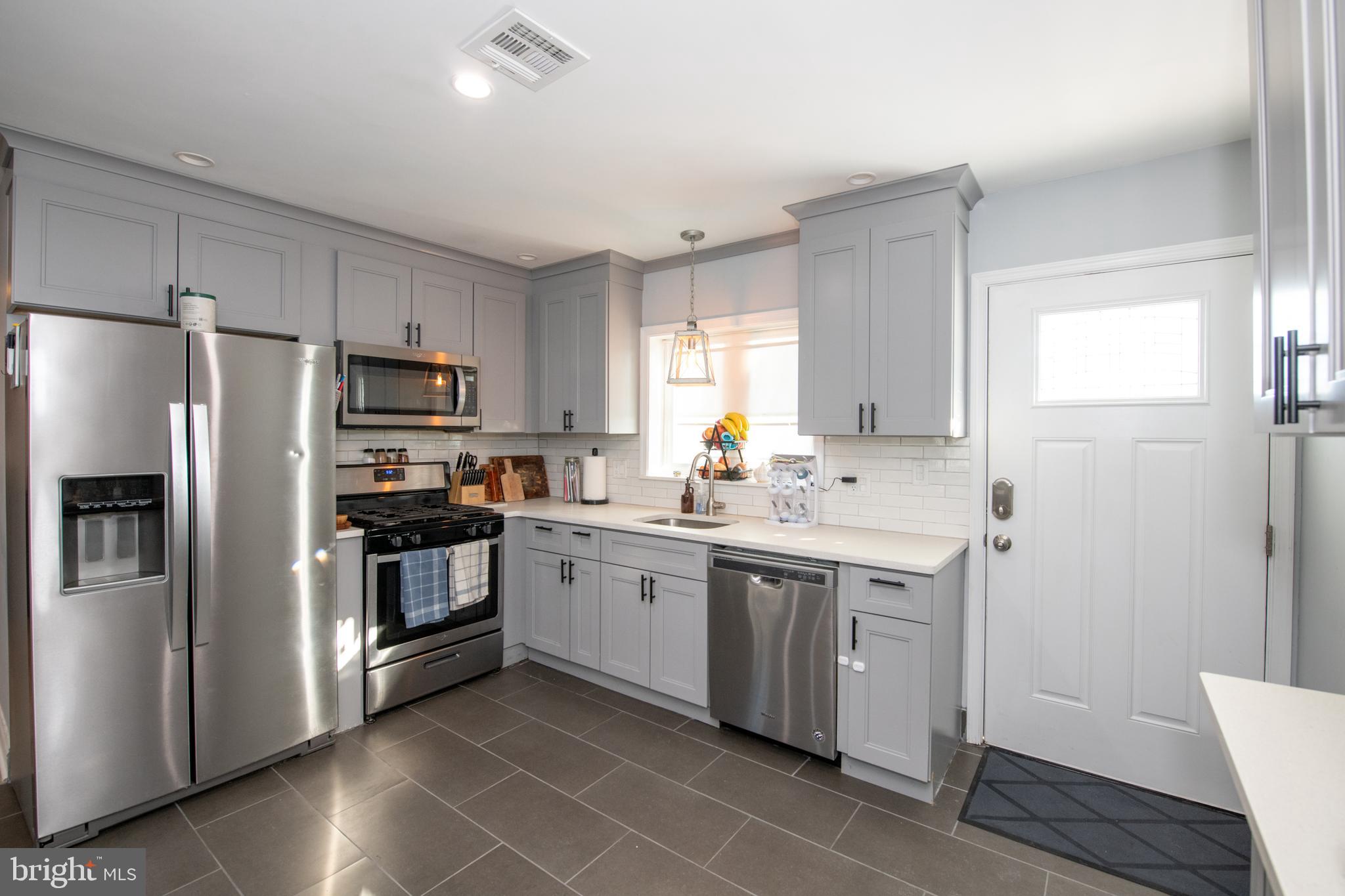 9304 Treaty Road Philadelphia, PA 19114 - Photo 11 of 43 a kitchen with a sink appliances and cabinets