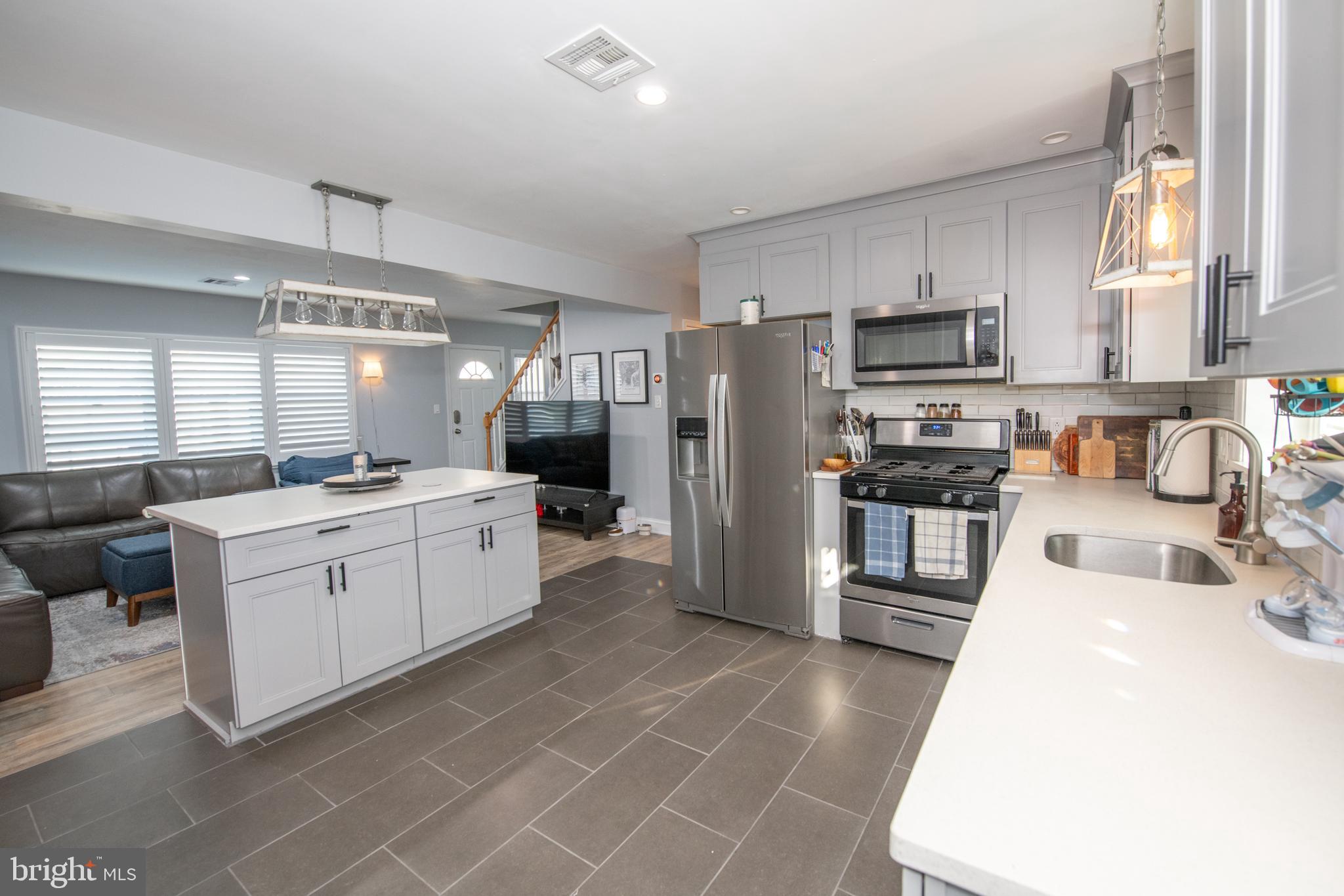 9304 Treaty Road Philadelphia, PA 19114 - Photo 15 of 43 a large white kitchen with cabinets