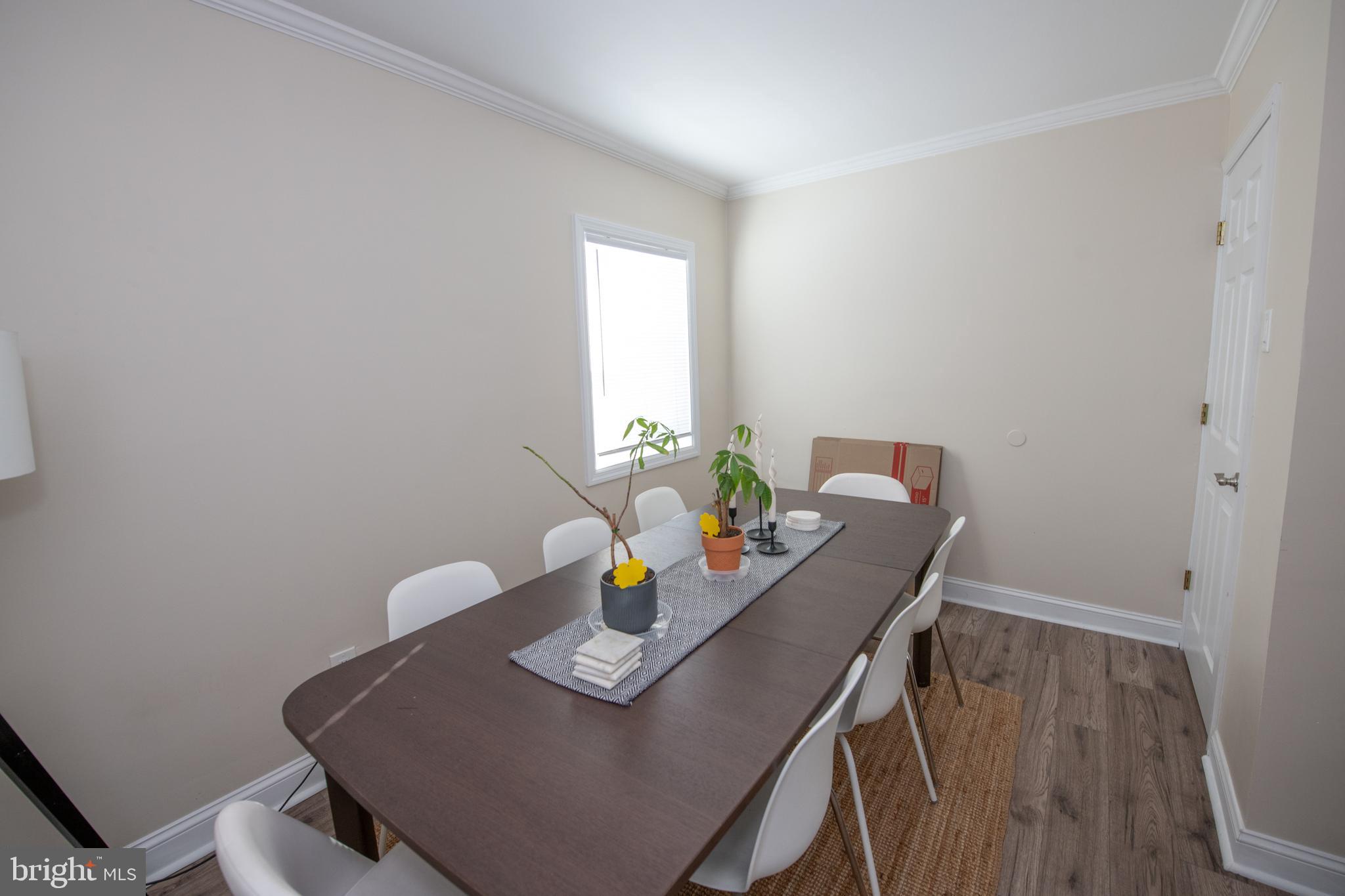 9304 Treaty Road Philadelphia, PA 19114 - Photo 19 of 43 a view of a dining room with furniture and wooden floor