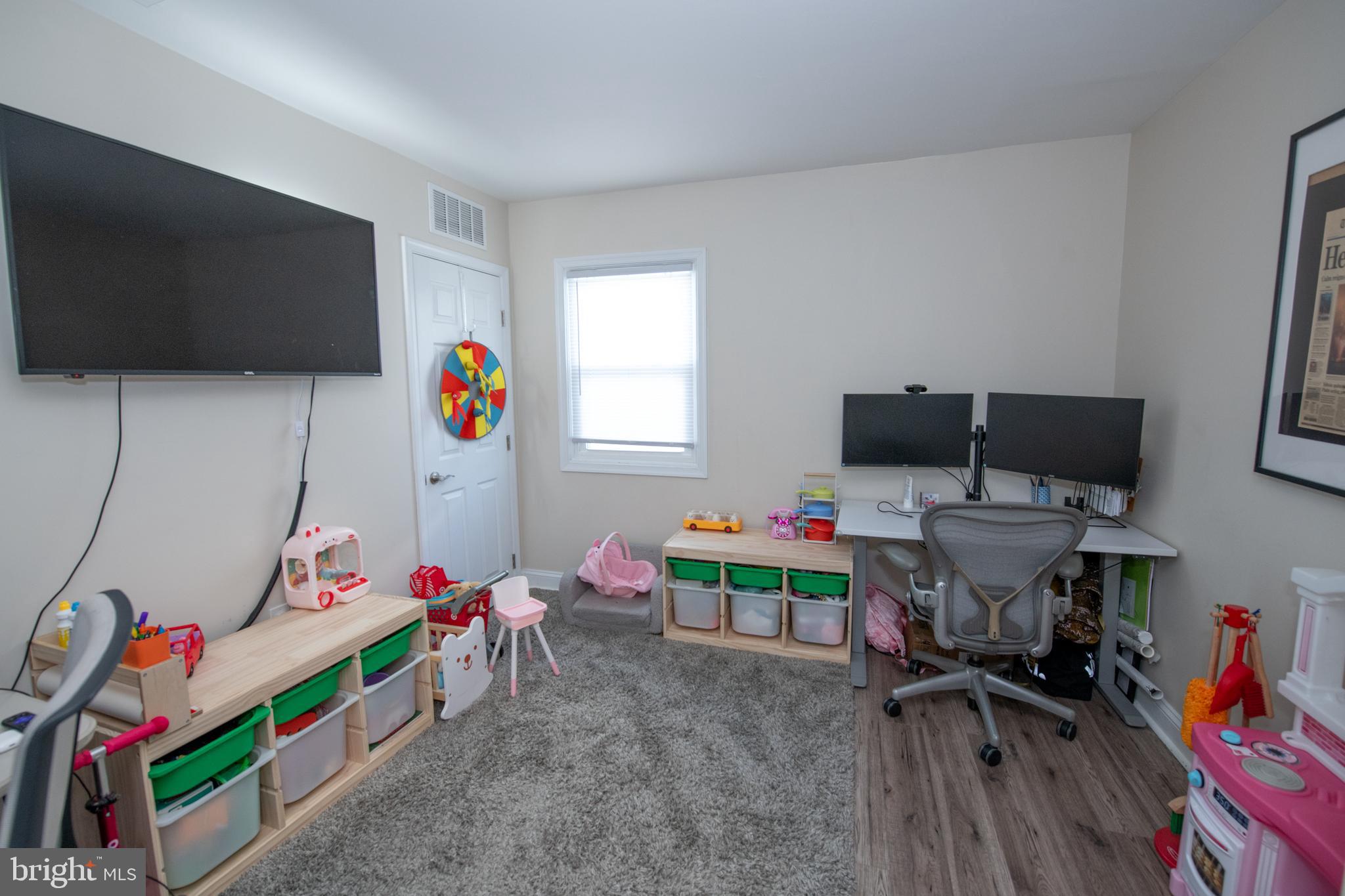 9304 Treaty Road Philadelphia, PA 19114 - Photo 21 of 43 a room with toys and a flat screen tv