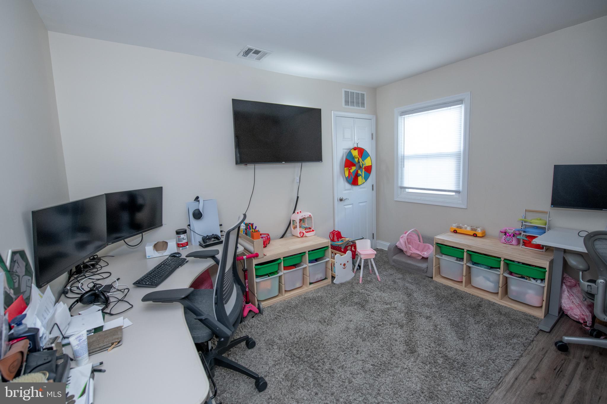 9304 Treaty Road Philadelphia, PA 19114 - Photo 22 of 43 a living room with furniture and a flat screen tv