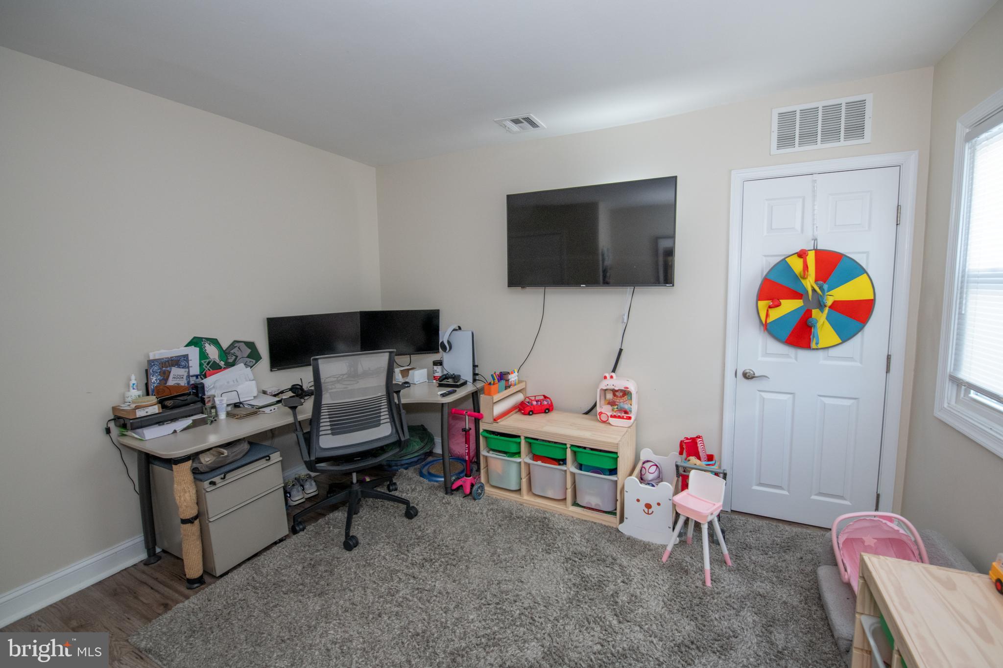 9304 Treaty Road Philadelphia, PA 19114 - Photo 24 of 43 a room with furniture and a flat screen tv