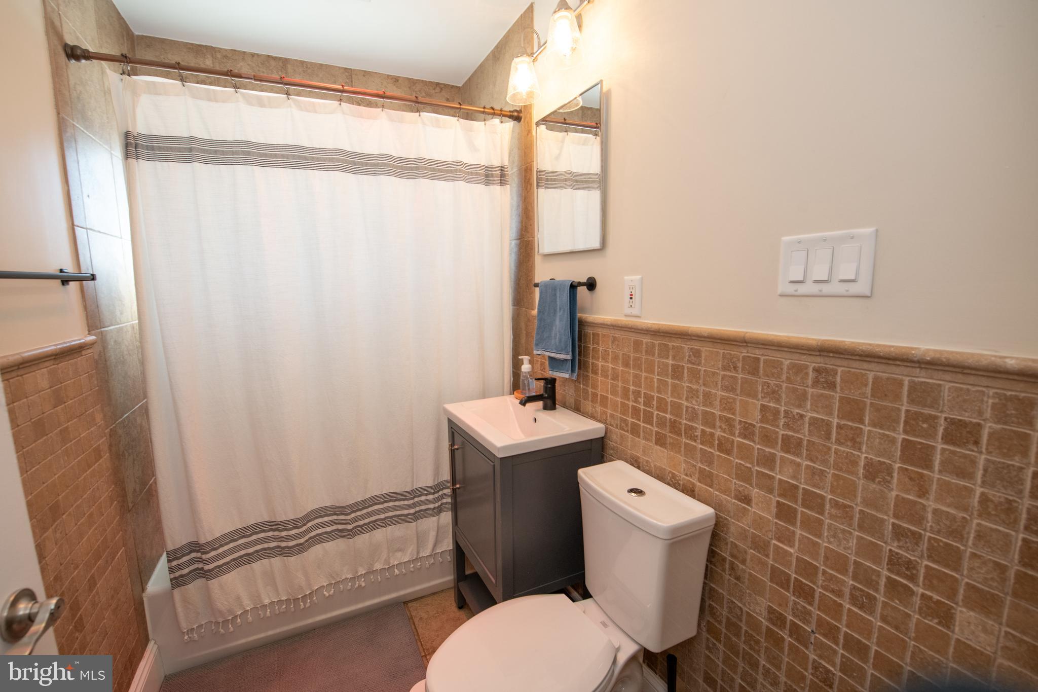 9304 Treaty Road Philadelphia, PA 19114 - Photo 28 of 43 a white toilet sitting next to a bathroom sink