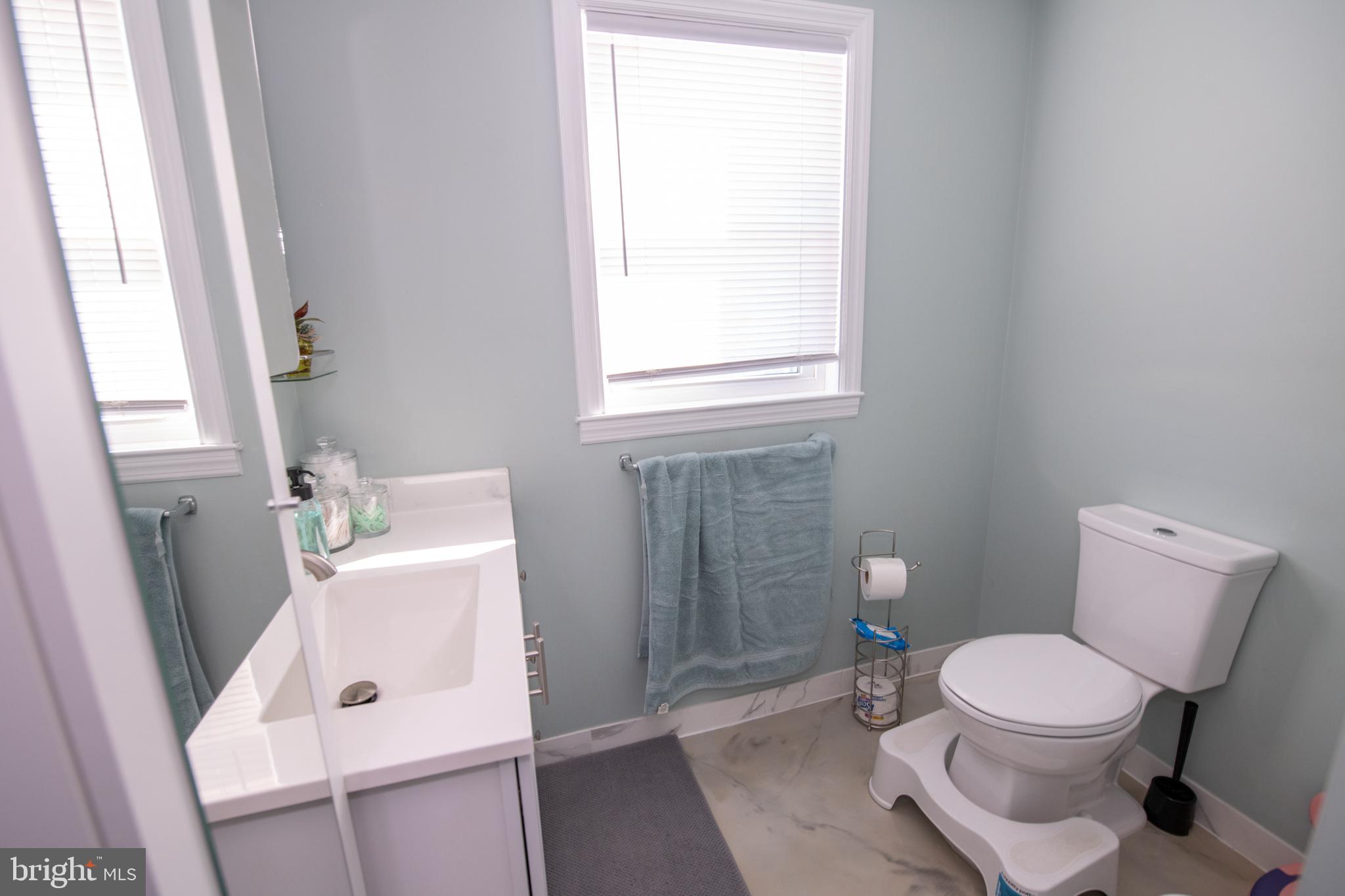 9304 Treaty Road Philadelphia, PA 19114 - Photo 34 of 43 a white toilet sitting next to a bathroom sink