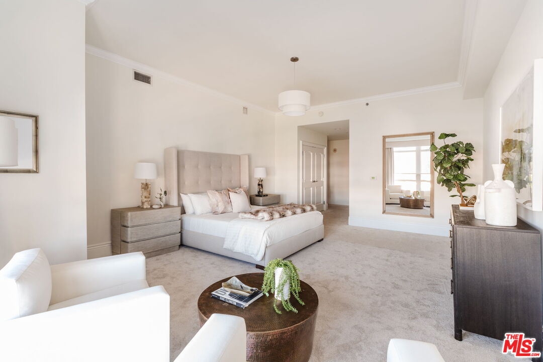 10800 Wilshire Boulevard, Unit 502 Los Angeles, CA 90024 - Photo 14 of 29 a living room with furniture and a large window