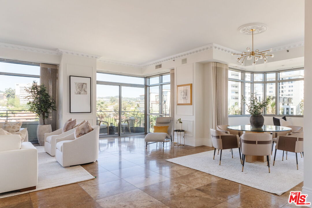 10800 Wilshire Boulevard, Unit 502 Los Angeles, CA 90024 - Photo 2 of 29 a living room with furniture and a large window