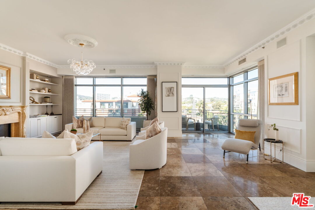 10800 Wilshire Boulevard, Unit 502 Los Angeles, CA 90024 - Photo 3 of 29 a living room with furniture and a large window