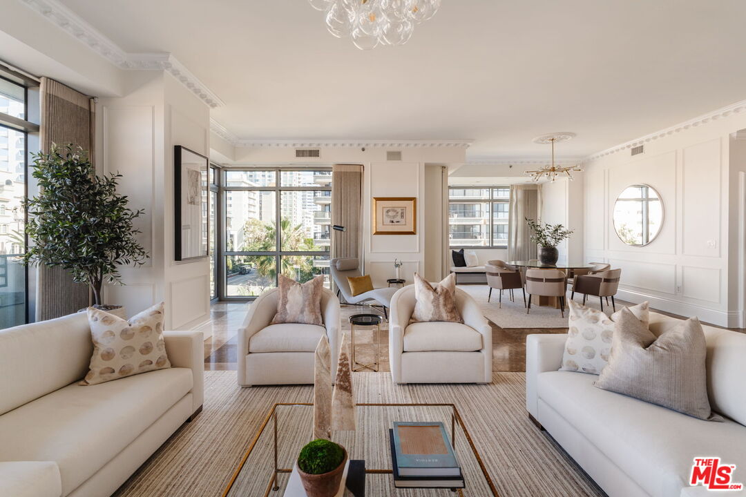 10800 Wilshire Boulevard, Unit 502 Los Angeles, CA 90024 - Photo 4 of 29 a living room with furniture and a large window