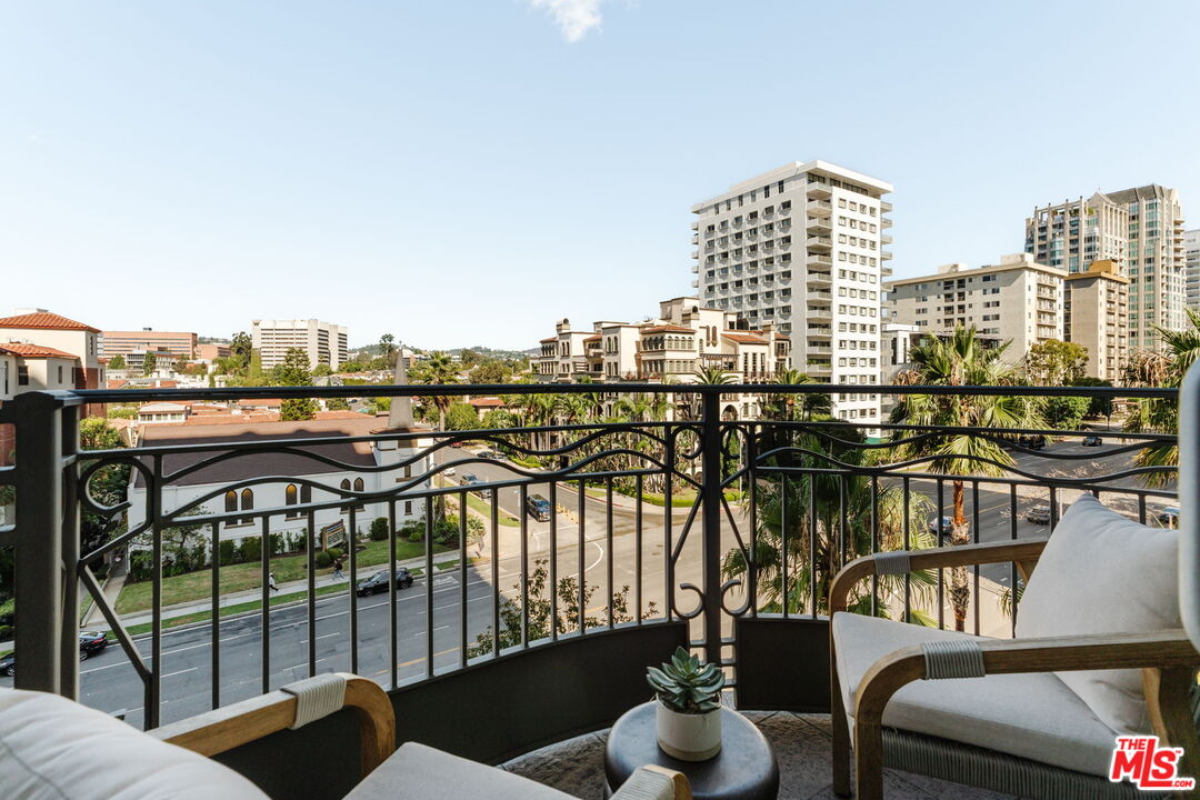 10800 Wilshire Boulevard, Unit 502 Los Angeles, CA 90024 - Photo 6 of 29 a view of a balcony with two chairs