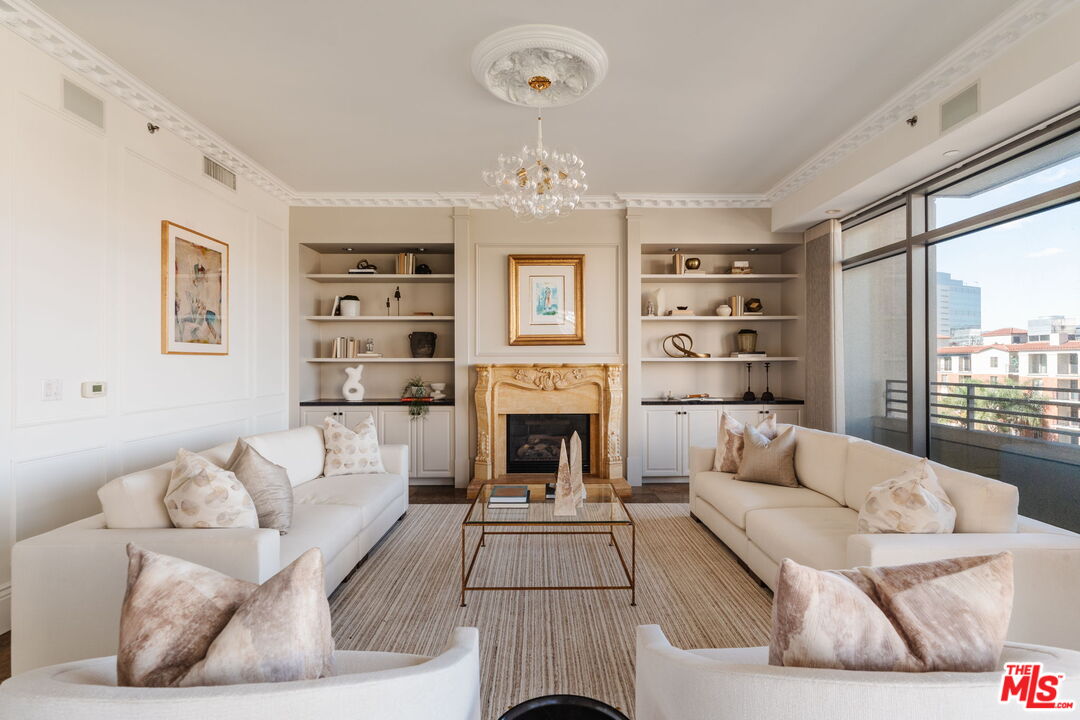 10800 Wilshire Boulevard, Unit 502 Los Angeles, CA 90024 - Photo 7 of 29 a living room with furniture fireplace and window