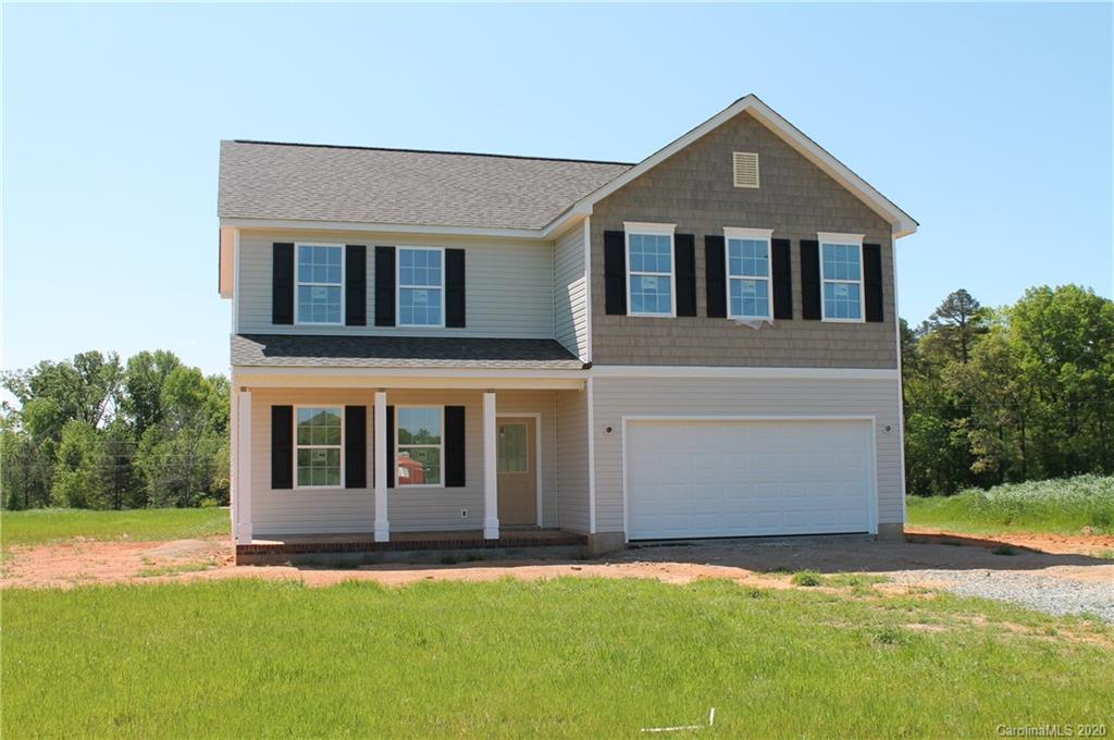 8607 Landsford Road Monroe, NC 28112 - Photo 1 of 3 a front view of a house with a yard