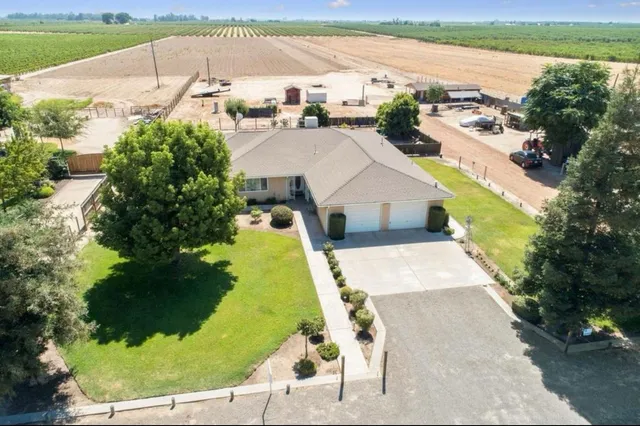 a view of a swimming pool with a yard