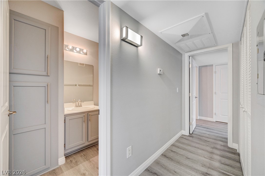3425 East Russell Road, Unit 223 Las Vegas, NV 89120 - Photo 26 of 47 Functional hallway space leads to a well-appointed bathroom with a spacious vanity.