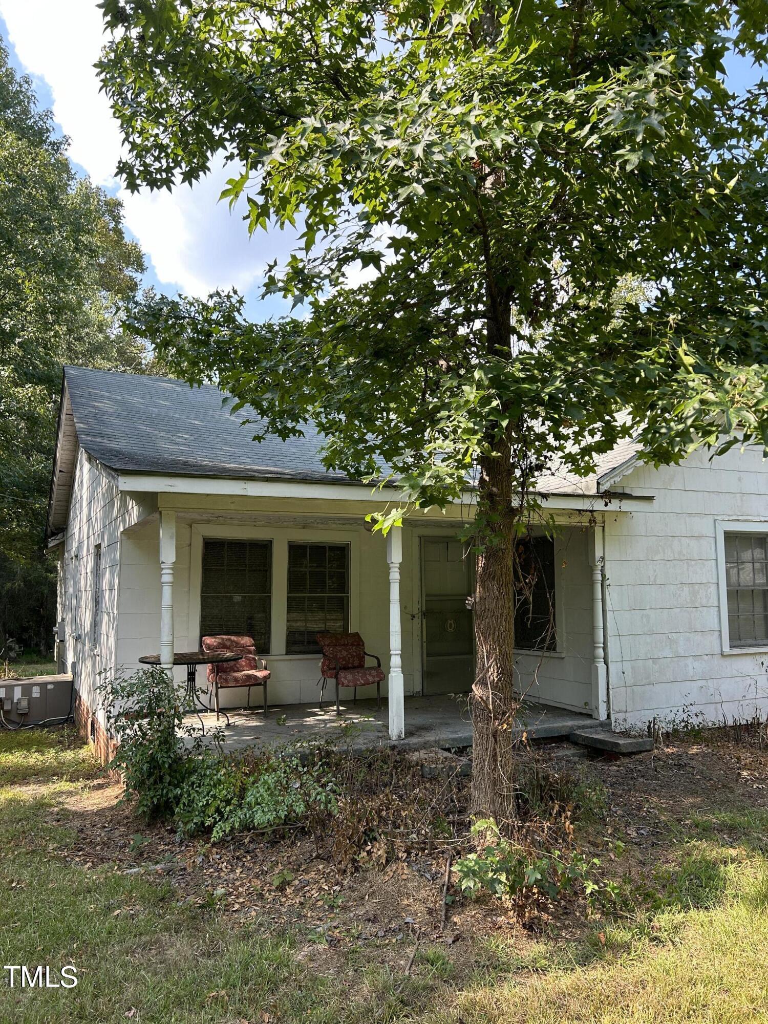 4285 Belltown Road Oxford, NC 27565 - Photo 1 of 6 a front view of house with yard and seating area