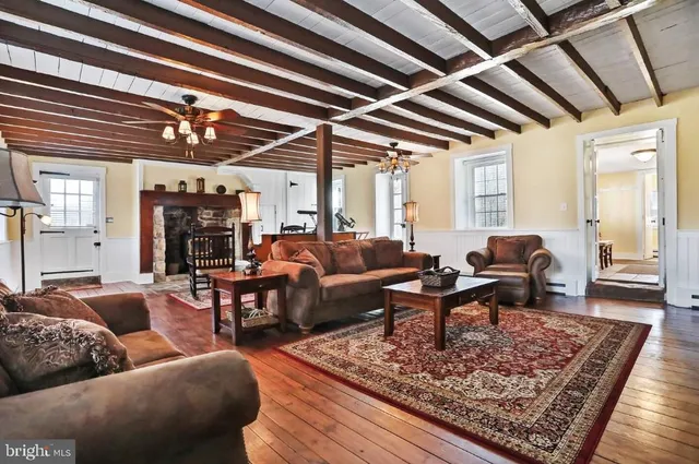 a living room with furniture and a rug