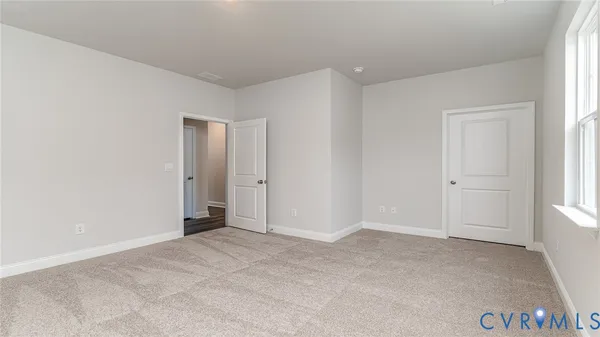 a view of an empty room and window